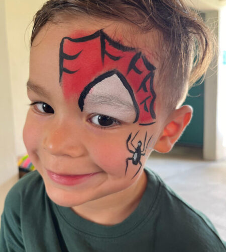 Child with Spiderman face painting at a kids' birthday party in Miami, Florida