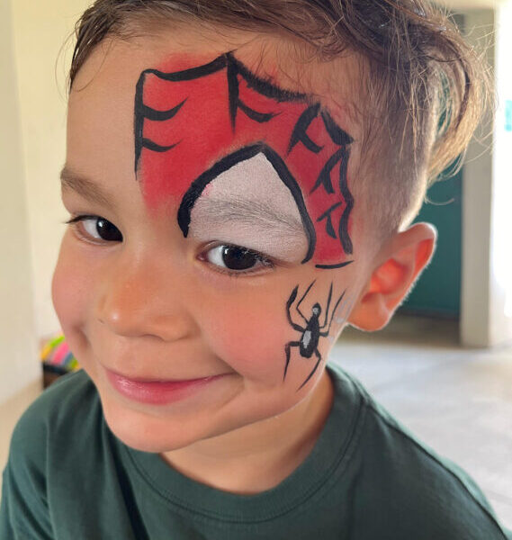 Child with Spiderman face painting at a kids' birthday party in Miami, Florida